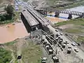 Aerial view of the erection site of a Medium Girder Bridge over the Kazer River, Mosul, Iraq, 2003.