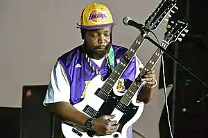 Afroman playing guitar onstage