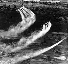 A U.S. Air Force Fairchild C-123 Provider aircraft crop-dusting in Vietnam during Operation Ranch Hand.