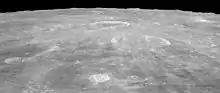 Oblique view facing south from Apollo 15, with Agrippa right of center, and the crater Godin above center showing bright rays.