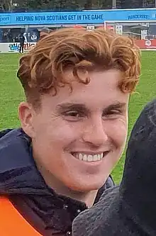 Close-up photo of a smiling man's face