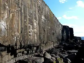 Single pitch traditional climbing on Mirror Wall, in Ailladie, Ireland