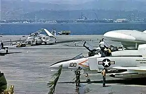 CVW-15 aircraft at NAS Alameda in 1974. USS Coral Sea is in the background.
