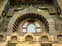 Exterior of chaitya hall, Cave 9, Ajanta Caves, 1st century BCE.  The chaitya arch window frame is repeated several times as a decorative motif.