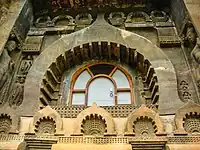 Chaitya arch around the window, and repeated as a gavaksha motif with railings, Cave 9, Ajanta.