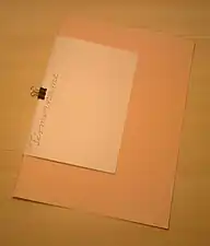 Used to attach a piece of paper to an envelope