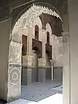 The "lambrequin" or muqarnas arch of the prayer hall's entrance