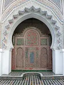 The wooden anaza at the courtyard entrance to the prayer hall
