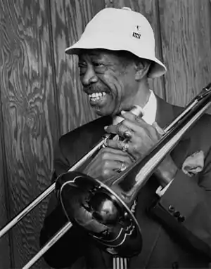 Image 4Al GreyPhotograph credit: William P. Gottlieb; restored by Adam CuerdenAl Grey (June 6, 1925 – March 24, 2000) was an American jazz trombonist who was known for his plunger-mute technique. After serving in World War II, he joined Benny Carter's band, then the bands of Jimmie Lunceford, Lucky Millinder, and Lionel Hampton. In the 1950s, he was a member of the big bands of Dizzy Gillespie and Count Basie before forming his own bands in the 1960s. This photograph by William P. Gottlieb shows Grey still performing into the 1980s.More selected portraits