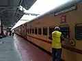 Kannur-Alappuzha Express parked on platform 2 of Thrissur railway station.