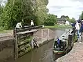 A boat leaving the bottom of the lock.