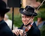 alex koffman poses with violin