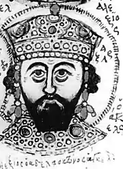 Black-and-white copy of a bust of a crowned, bearded man