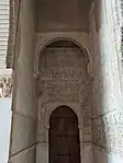 Doorway for the staircase to the upper floor, located between the walls of the two archways at the entrance to the hall (on the west side)