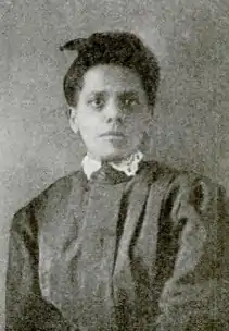 Portrait of an African-American woman, wearing a dark dress with a white lace collar.