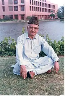 'Allamah Hunzai pictured in front of the Aga Khan University Hospital, Karachi.