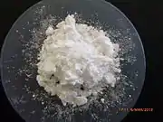 Heap of white powder on a watch glass