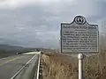 Historical marker near Dewart, with the replacement bridge behind