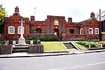 Geering's Almshouses and attached walls and gate