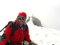 Alpinist on summit of Mont Dolent