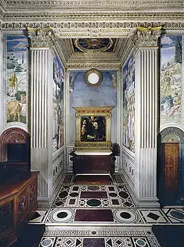 The copy in the Magi Chapel of the Palazzo Medici, flanked by parts of Gozzoli's frescos