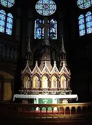 Skien Church's altar piece is shaped like a church facade with portals and towers and surrounded by stained glass windows