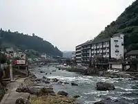 Amagase Onsen hotels and ryokans along Kusu River.