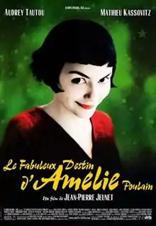 Against a bright green background is a young woman, wearing a red sweater. Her dark hair is cut into short bob and her lips are red and her skin pale. She smiles mischievously. The full title is include below in large yellow lettering.