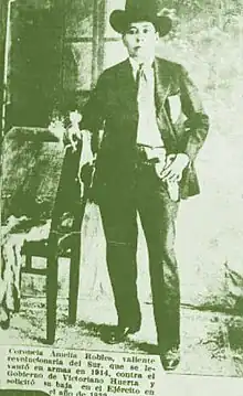 Photo of Robles from a newspaper leaning against a chair with a cigarette in his hand