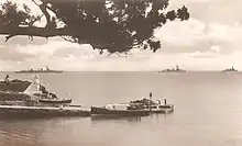 America and West Indies Station 1st Division (HMS Dragon, HMS Danae and HMS Despatch) off Admiralty House in 1931 as they depart the Royal Naval Dockyard to exercise on the open ocean