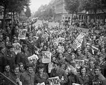 Allied military personnel in Paris celebrating V-J Day on August 15, 1945
