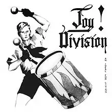 a black and white illustration of a Hitler Youth beating a drum. To the right the band’s name is stylized in blackletter with an exclamation point before the word “Joy”
