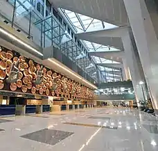 hands extending from a wall over the immigration counters