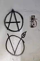 photograph of circle-A and circle-V graffiti on wall