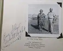 Anna Moore Shaw stands next to a man in a black and white photograph secured to the title page of her book Pima Indian Legends.