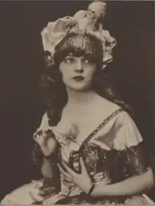 A young white woman wearing a showgirl costume, from 1921.