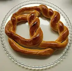 A pretzel baked in the shape of a (–2,3,7) pretzel knot, with shiny egg glaze