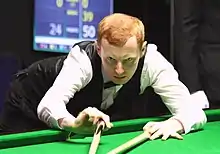 Anthony McGill (pictured in 2016) playing a shot with the rest