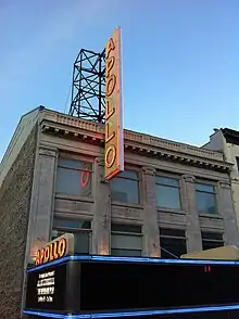 Close-up view of the upper facade and marquee of the Apollo Theater