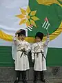 Abkhazian children waving miniature flags of Abkhazia