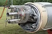 An arc dipole magnet. Electrical bus slots (top and bottom) and beam tube (middle) at the top section of the vacuum shell