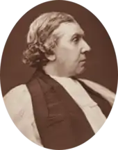 stout, clean-shaven white man in clerical dress