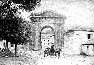 The gate of Curtius's La Cavada factory in Cantabria, Spain (1890).