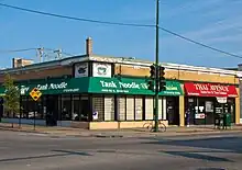 Restaurants in a single story building on a street corner