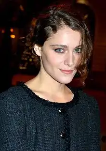 Ariane Labed at the 2015 César Awards facing to the front, wearing a dark blue dress