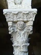 Cloister column capital with face