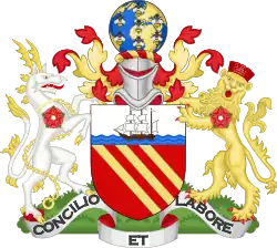 Gules, three bendlets enhanced Or; a chief argent, thereon on waves of the sea a ship under sail proper. On a wreath of colours, a terrestrial globe semée of bees volant, all proper. On the dexter side a heraldic antelope argent, attired, and chain reflexed over the back Or, and on the sinister side a lion guardant Or, murally crowned Gules; each charged on the shoulder with a rose of the last. Motto: "Concilio et Labore".