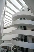 Inner staircase. The white smooth walls are typical of the building's interior.