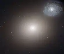 Arp 116 is composed of a giant elliptical galaxy known as Messier 60, and a much smaller spiral galaxy, NGC 4647.