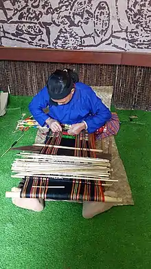 Weaving traditional Hlai narrow cloth